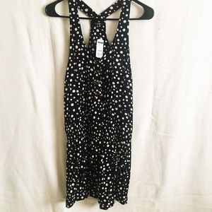 Polka dot romper with pockets, black and cream